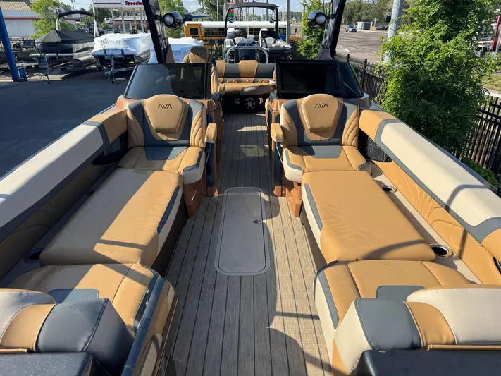  Yacht Photos Pics Luxurious 2025 Avalon Excalibur 27' boat interior with spacious seating and elegant design.