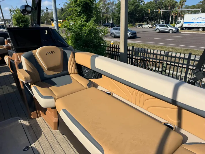  Yacht Photos Pics Luxurious seating on 2025 Avalon Excalibur 27' boat, featuring tan and gray upholstery.