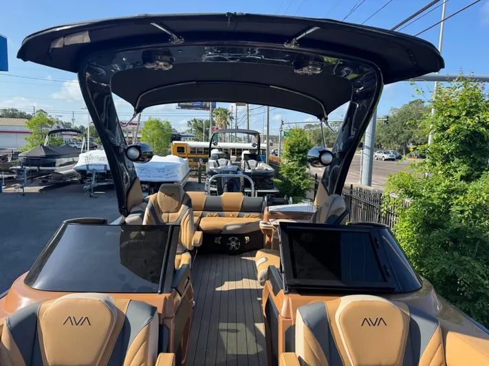  Yacht Photos Pics Luxurious 2025 Avalon Excalibur 27' boat with sleek design and spacious seating.