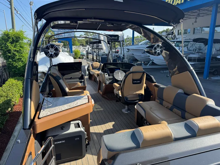  Yacht Photos Pics Luxurious 2025 Avalon Excalibur 27' boat interior with modern seating and advanced audio system.