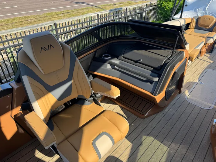  Yacht Photos Pics Luxurious 2025 Avalon Excalibur 27' boat interior with tan leather seating and sleek design.