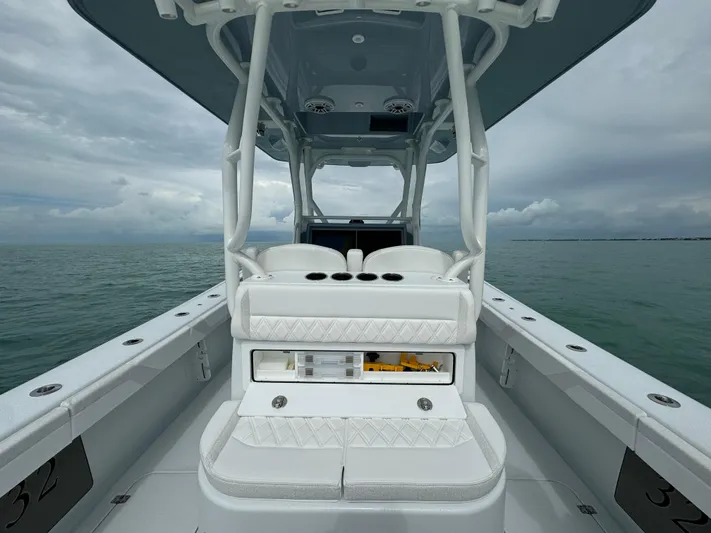  Yacht Photos Pics 2025 Yellowfin 32 boat interior with white seating on a cloudy day.