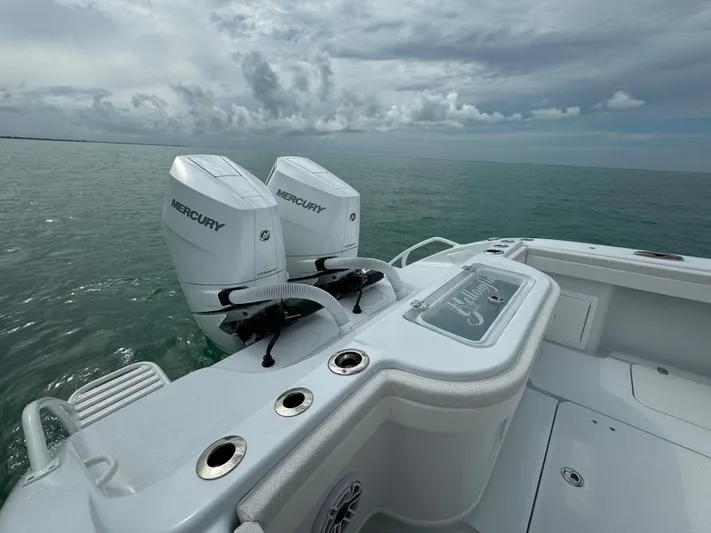  Yacht Photos Pics 2025 Yellowfin 32 boat with twin Mercury engines on open water.
