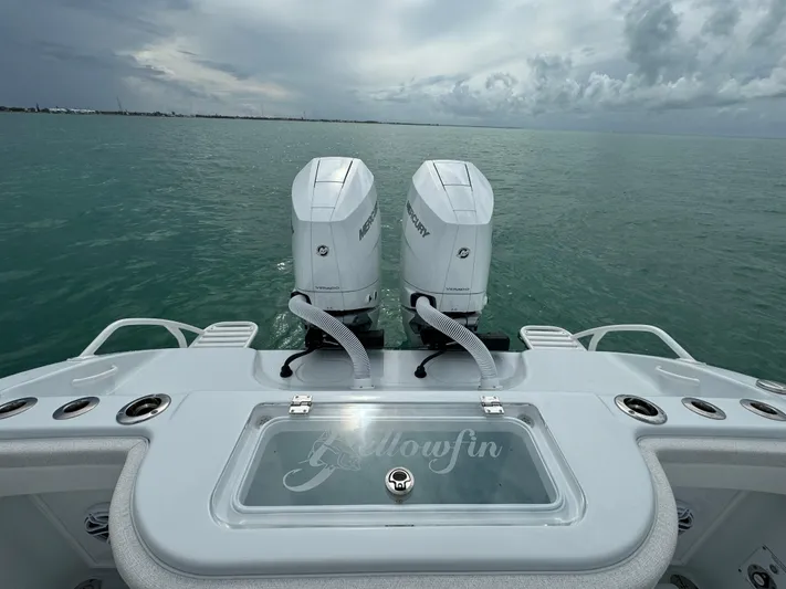  Yacht Photos Pics 2025 Yellowfin 32 boat with dual Mercury engines on open water.