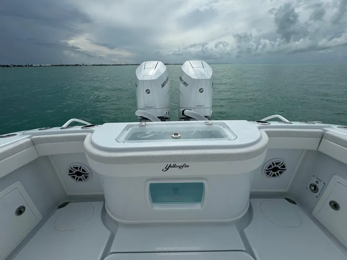  Yacht Photos Pics 2025 Yellowfin 32 boat with twin outboard motors on calm sea.