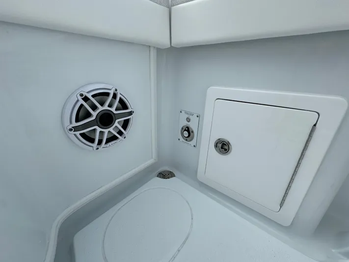 Yacht Photos Pics 2025 Yellowfin 32 boat interior with speaker and storage compartment.