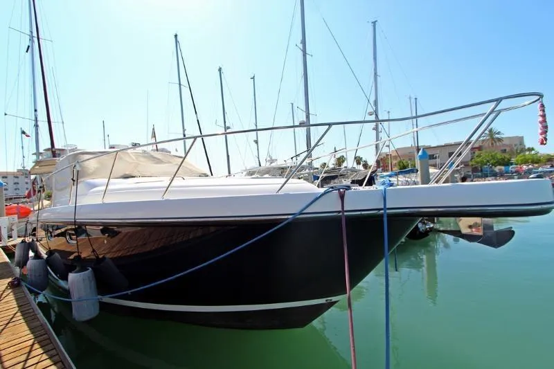  Yacht Photos Pics 2005 Tiara Yachts 3600 Sovran docked in a marina under clear skies.