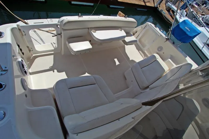  Yacht Photos Pics 2005 Tiara Yachts 3600 Sovran cockpit with white seating and table, docked at marina.