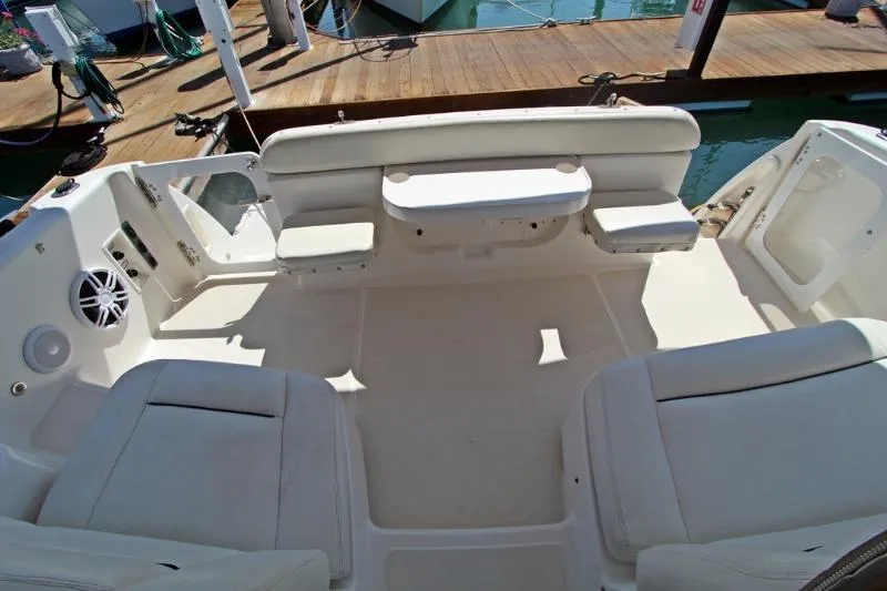  Yacht Photos Pics 2005 Tiara Yachts 3600 Sovran cockpit with white seating and table, docked at marina.