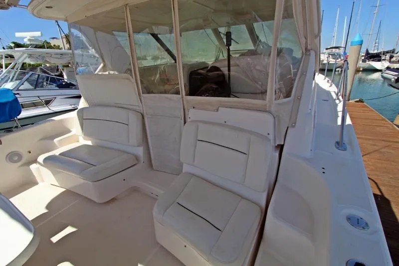  Yacht Photos Pics 2005 Tiara Yachts 3600 Sovran cockpit with white seating, docked at marina.