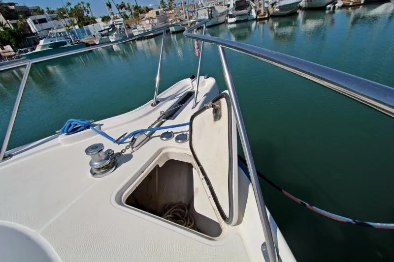  Yacht Photos Pics 2005 Tiara Yachts 3600 Sovran bow with open anchor locker in marina setting.