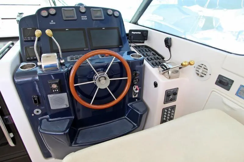  Yacht Photos Pics Helm of 2005 Tiara Yachts 3600 Sovran with steering wheel and control panel.