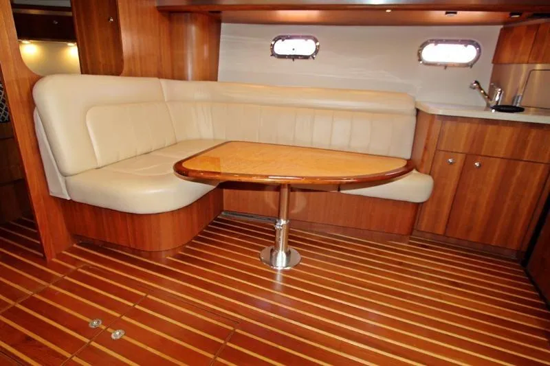  Yacht Photos Pics Luxurious interior of 2005 Tiara Yachts 3600 Sovran with wood finish and leather seating.