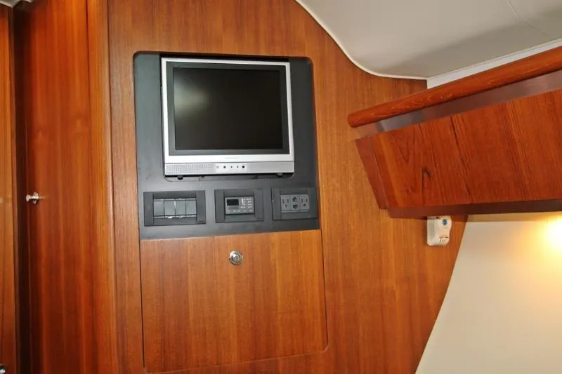  Yacht Photos Pics 2005 Tiara Yachts 3600 Sovran interior with mounted TV and control panel.