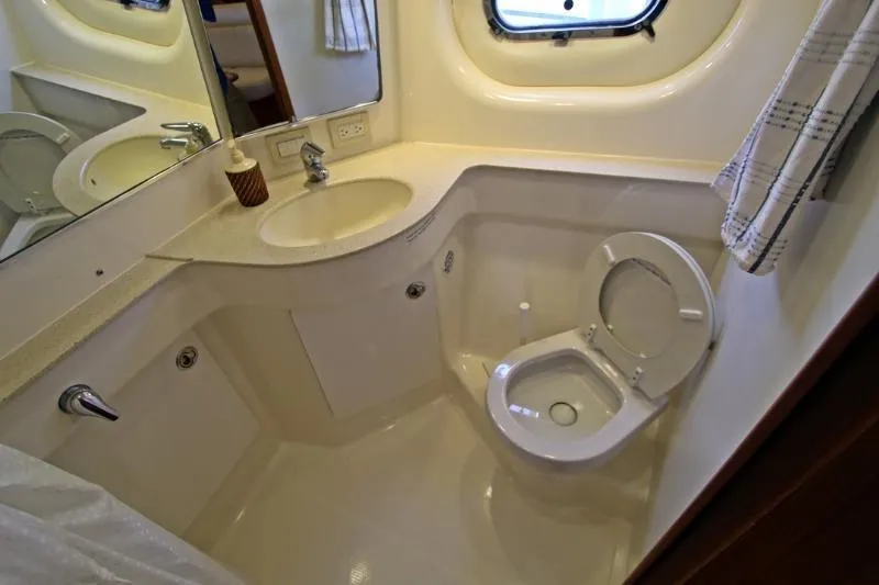  Yacht Photos Pics Bathroom interior of 2005 Tiara Yachts 3600 Sovran with sink and toilet.