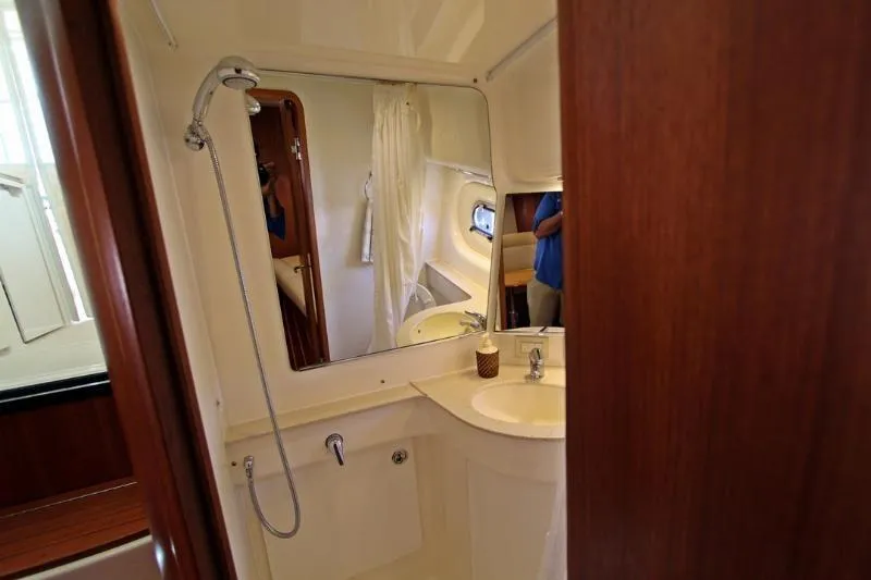  Yacht Photos Pics Bathroom interior of 2005 Tiara Yachts 3600 Sovran with shower and sink.