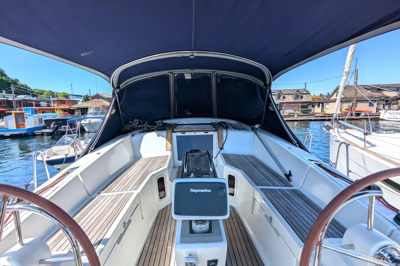 Windwaker Yacht Photos Pics 2013 Jeanneau 41 Deck Salon cockpit with dual steering wheels and navigation equipment.
