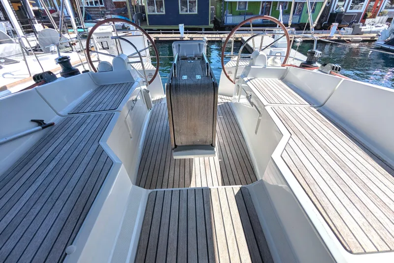 Windwaker Yacht Photos Pics 2013 Jeanneau 41 Deck Salon cockpit with dual steering wheels and teak flooring.