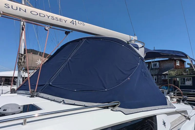 Windwaker Yacht Photos Pics 2013 Jeanneau Sun Odyssey 41 Deck Salon sailboat with blue canvas cover.