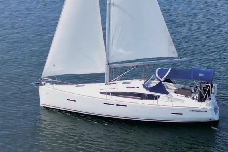 Windwaker Yacht Photos Pics Sailing yacht Jeanneau 41 Deck Salon 2013 gliding on calm waters.