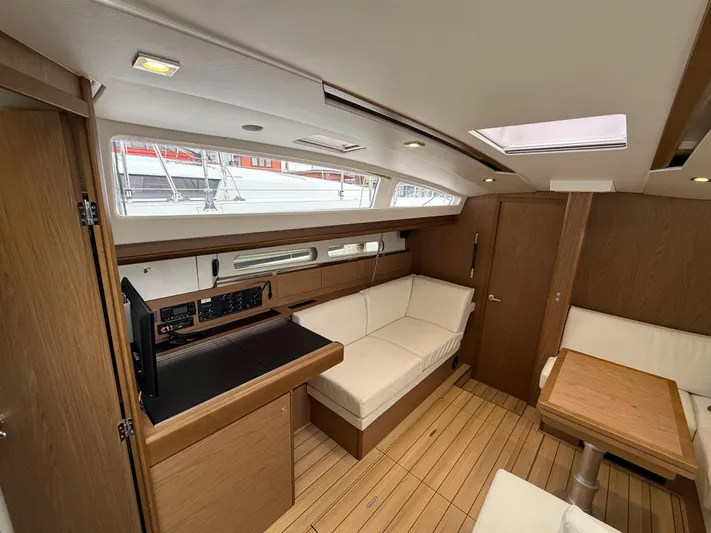 Windwaker Yacht Photos Pics Interior of 2013 Jeanneau 41 DS yacht, featuring modern wood finish and comfortable seating.