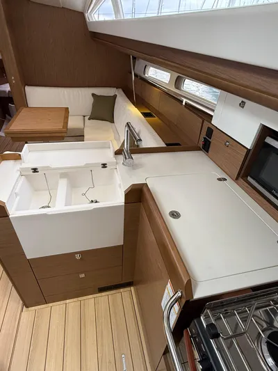 Windwaker Yacht Photos Pics Interior of 2013 Jeanneau 41 DS sailboat with modern kitchen and seating area.