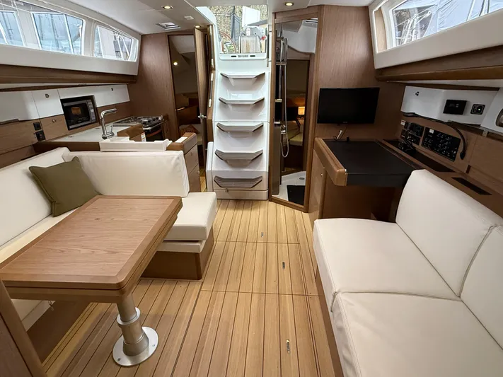 Windwaker Yacht Photos Pics Interior of 2013 Jeanneau 41 DS yacht, featuring modern wood finish and comfortable seating.