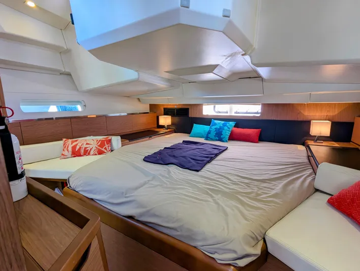 Windwaker Yacht Photos Pics Luxurious interior of 2013 Jeanneau 41 DS yacht with cozy bedding and modern decor.