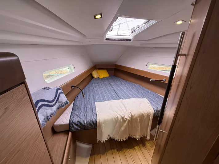 Windwaker Yacht Photos Pics Cozy cabin interior of 2013 Jeanneau 41 DS sailboat with bed and skylight.