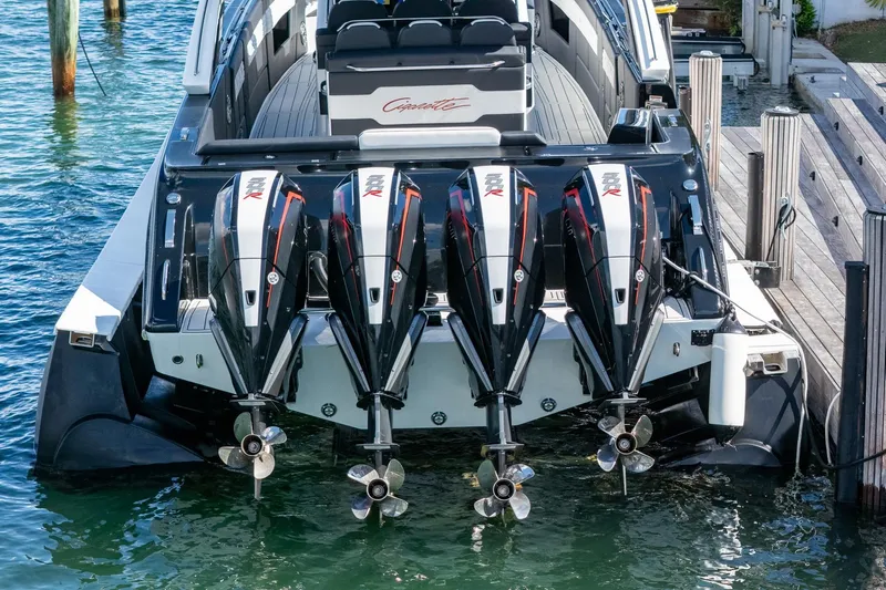  Yacht Photos Pics 2024 Cigarette 42 Auroris boat with four powerful outboard engines docked at marina.