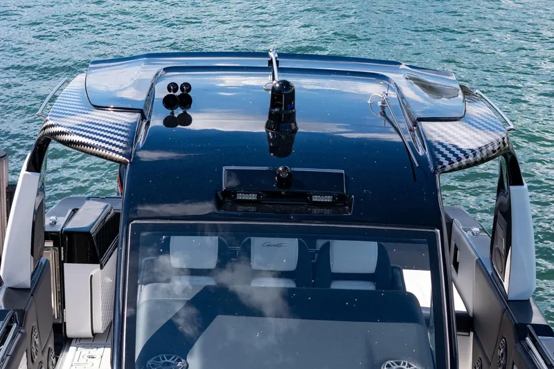  Yacht Photos Pics 2024 Cigarette 42 Auroris boat with sleek design on water.