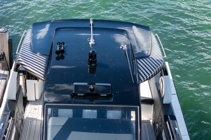  Yacht Photos Pics 2024 Cigarette 42 Auroris boat with sleek design on water.