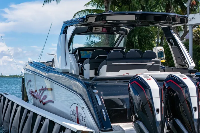  Yacht Photos Pics 2024 Cigarette 42 Auroris luxury boat docked with twin engines, sleek design, and modern features.