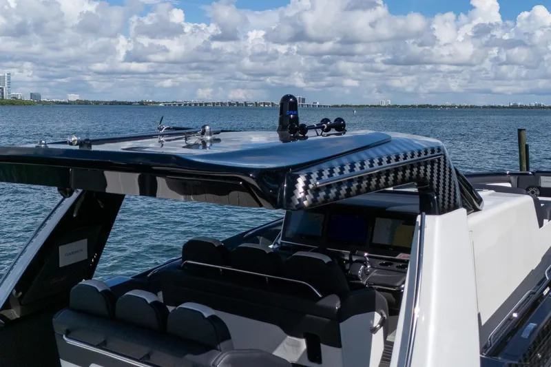  Yacht Photos Pics 2024 Cigarette 42 Auroris boat with sleek design on a sunny waterfront.