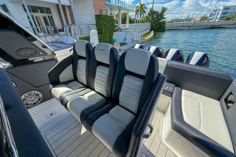  Yacht Photos Pics 2024 Cigarette 42 Auroris boat interior with luxury seating and multiple outboard engines.
