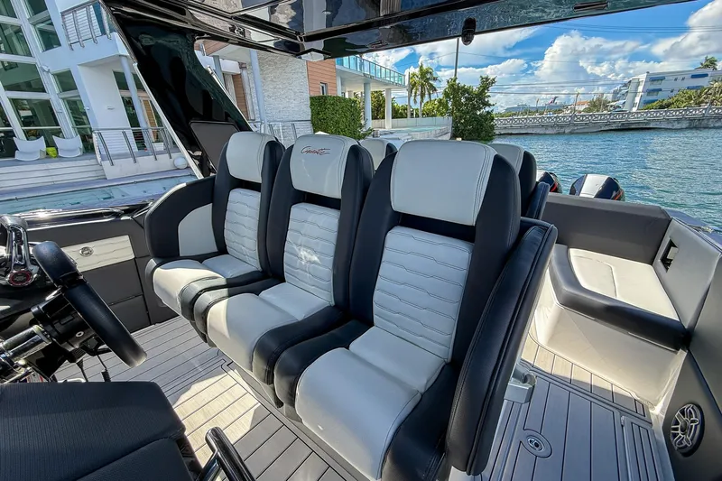  Yacht Photos Pics 2024 Cigarette 42 Auroris boat interior with luxurious seating and waterfront view.