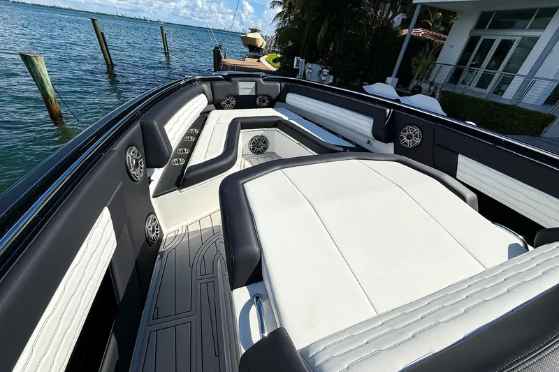  Yacht Photos Pics 2024 Cigarette 42 Auroris luxury boat interior with white seating and sleek design.