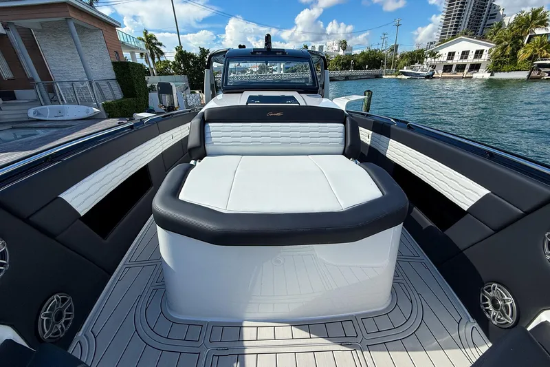  Yacht Photos Pics 2024 Cigarette 42 Auroris luxury boat interior with sleek seating and waterfront view.