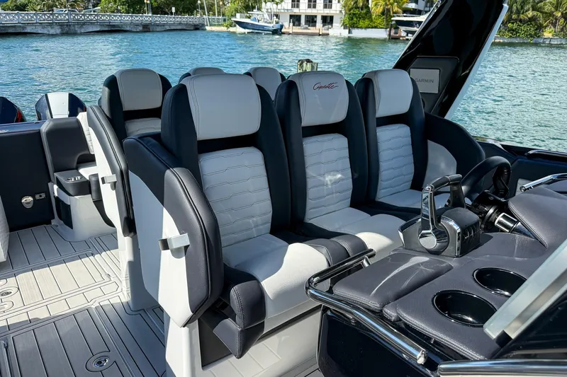  Yacht Photos Pics 2024 Cigarette 42 Auroris luxury boat interior with sleek seating and modern controls.