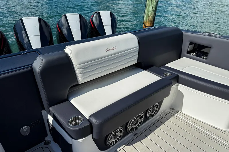  Yacht Photos Pics Luxury seating on 2024 Cigarette 42 Auroris boat with powerful engines in background.