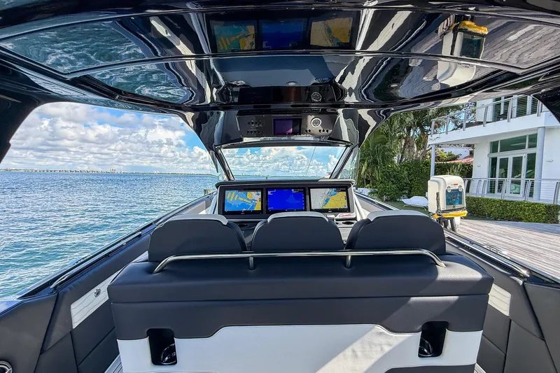  Yacht Photos Pics Interior view of 2024 Cigarette 42 Auroris boat with navigation screens and luxurious seating.