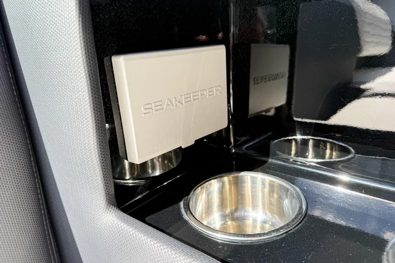  Yacht Photos Pics 2024 Cigarette 42 Auroris boat interior with Seakeeper stabilizer and cup holders.