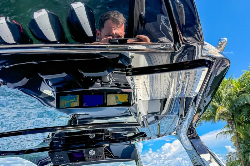  Yacht Photos Pics 2024 Cigarette 42 Auroris boat dashboard with reflections and blue sky background.