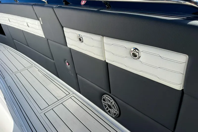  Yacht Photos Pics 2024 Cigarette 42 Auroris boat interior with sleek black and white paneling and speaker.