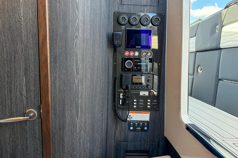  Yacht Photos Pics Control panel inside 2024 Cigarette 42 Auroris boat, featuring advanced navigation and communication systems.