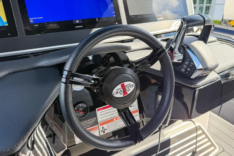  Yacht Photos Pics Steering wheel and controls of 2024 Cigarette 42 Auroris boat cockpit.
