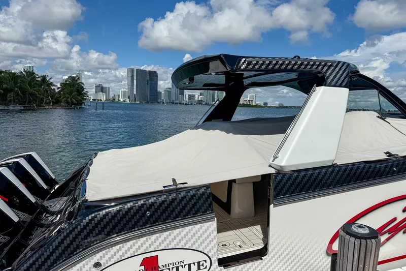 Yacht Photos Pics 2024 Cigarette 42 Auroris boat docked with city skyline in background.