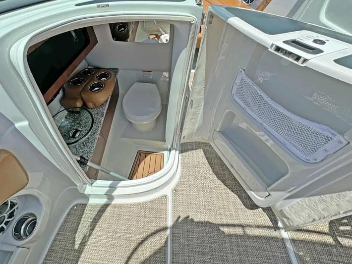  Yacht Photos Pics 2024 Crownline 290 XSS boat interior with modern bathroom and sleek design.