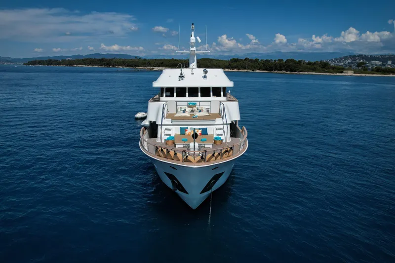 Eva Yacht Photos Pics Luxurious 1993 Cheoy Lee Custom yacht on serene blue waters, featuring spacious deck.