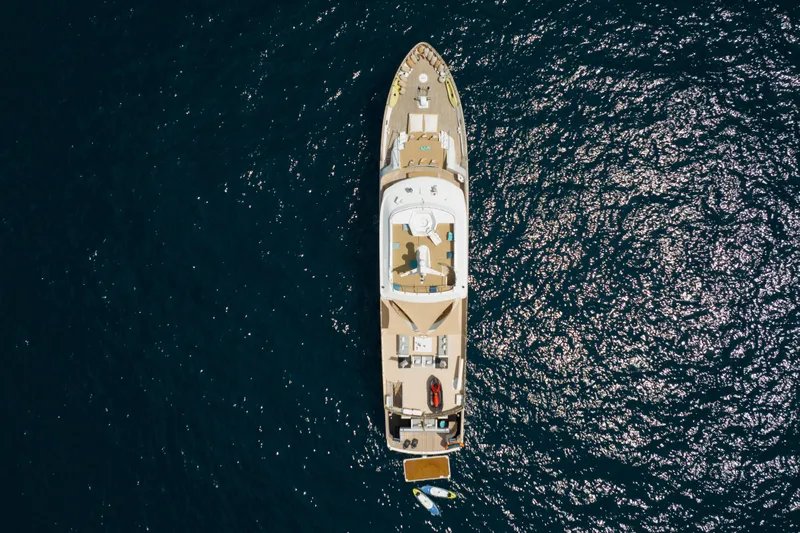 Eva Yacht Photos Pics Aerial view of 1993 Cheoy Lee Custom yacht on shimmering blue water.